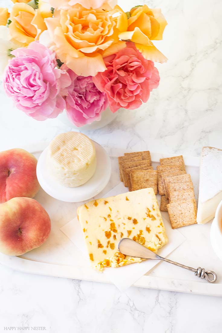 Learn how to create this yummy appetizer board. It only takes a few minutes, and yet it is a delicious combination of fruit and cheeses. #appetizers #parties #entertaining #charcuterieboards #charcuterie #recipes