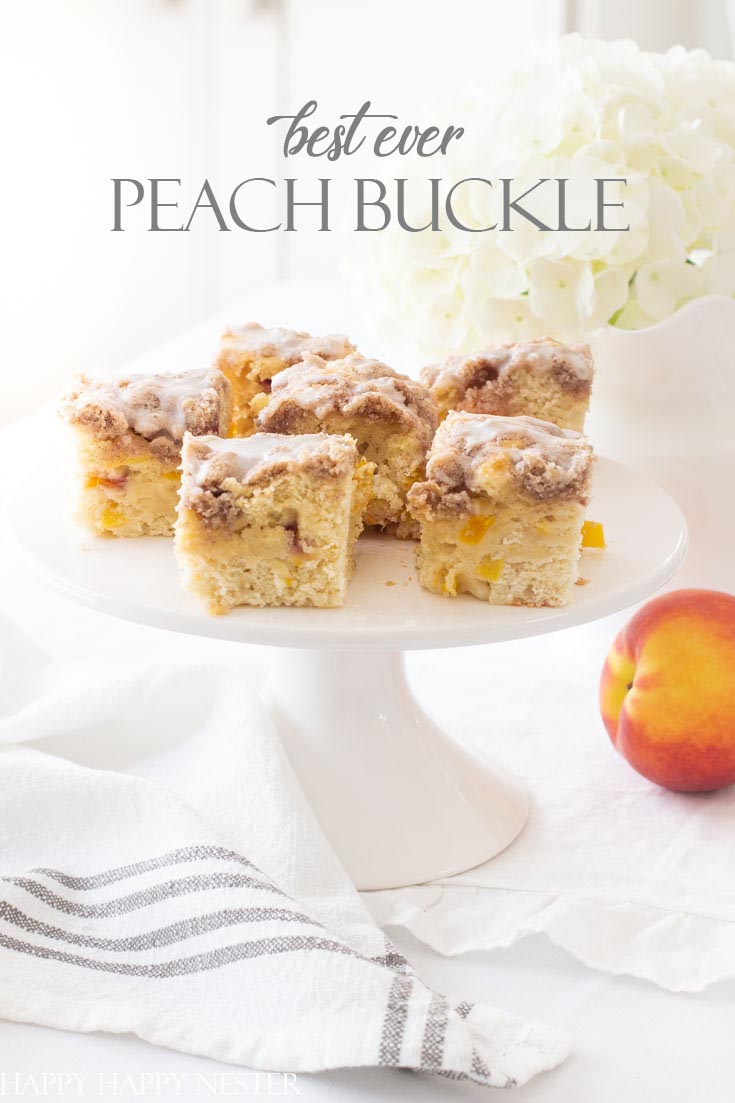 Here is the best ever peach buckle recipe and is the perfect summer dessert. This easy recipe is fresh and yummy with a cinnamon crumble and vanilla icing. Add a dollop of ice cream to accompany this summer cake. #recipes #peaches #freshfruitrecipes #desserts