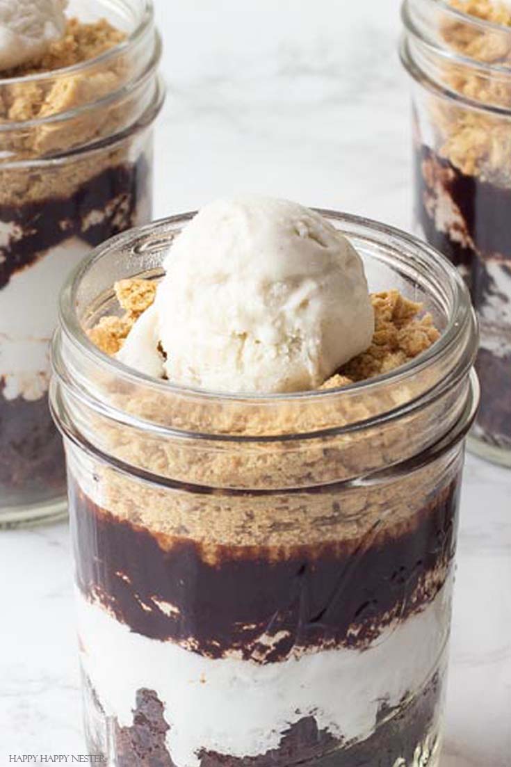 Need a tasty treat? This S'mores Recipe in a Jar is a yummy choice if you want a different version of a s'more. No need to roast your marshmallows. This recipe calls for brownies, but no need to bake, buy store-bought brownies as an easy dessert. #s'mores #s'moresrecipe #desserts #chocolatebrownies #chocolatedesserts