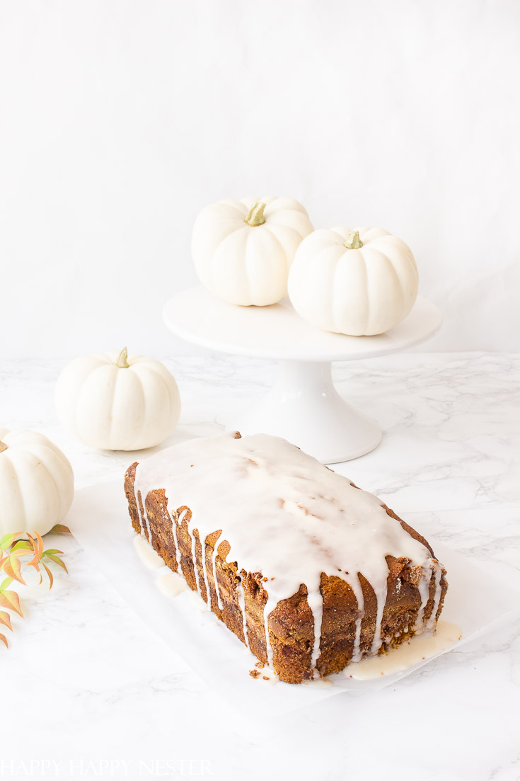 This Moist Pumpkin Bread Recipe has a cinnamon, sugar and nut swirl in the middle and topped with icing. Also, this pumpkin bread is easy to make and yummy and better than the Starbuck's pumpkin bread. This the best recipe you'll ever find. #recipes #thebestpumpkinbread #icedpumpkinbread