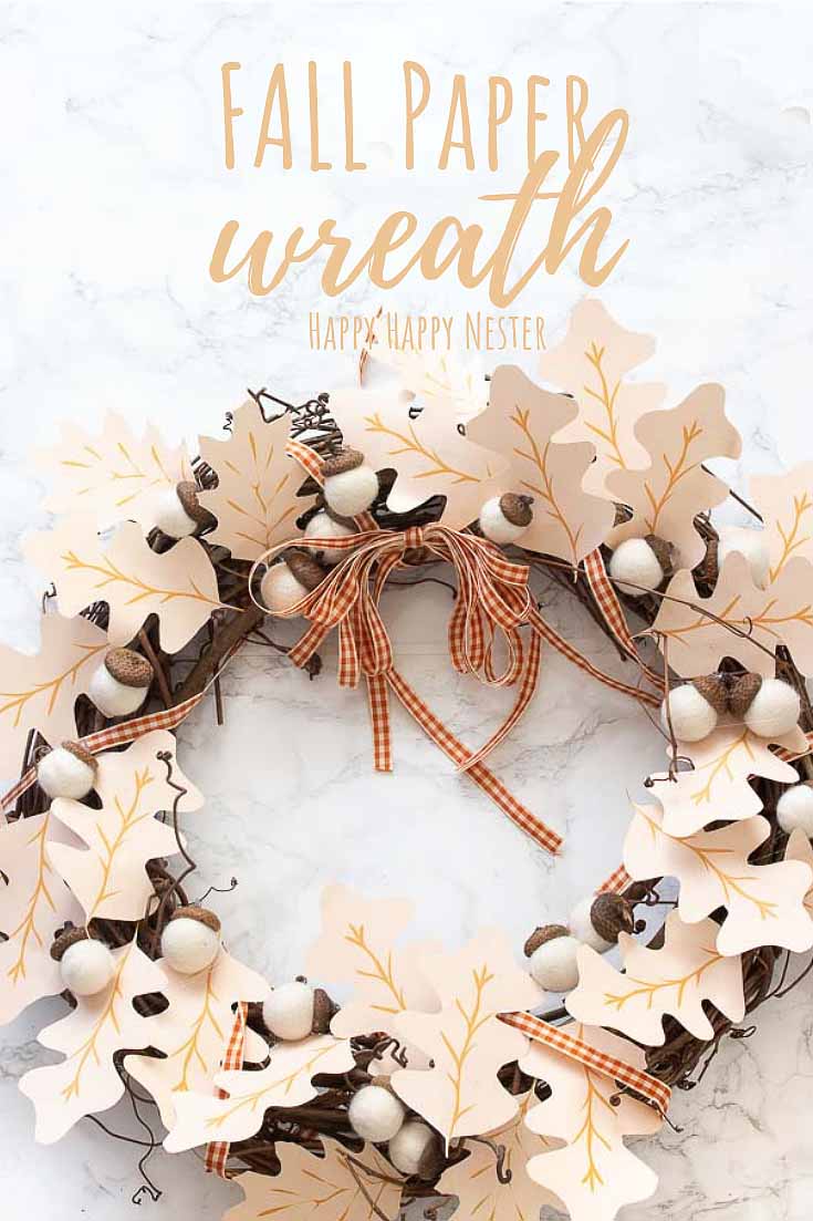 Need some Fall Wreath Ideas DIY? This paper wreath DIY is so easy to make, and the results are pretty. Not only is this a simple wreath to make it is pretty inexpensive since it requires paper leaves. #crafts #papercrafts #fallwreath #wreaths