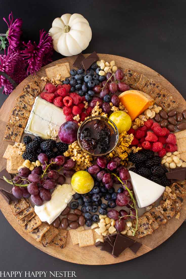 Charcuterie boards are the best for display appetizers. Pick out a round, square or rectangular, one and then build all your food on it. They are perfect for a big crowd of friends or family. You'll never run out of great appetizers to add to your board. #charcuterieboards #entertaining #partyappetizers #appetizers #appetizerdiy