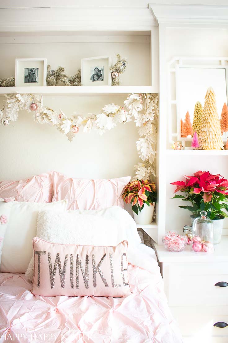 Who says you can only decorate only in red and green? Well, if you love pink and red then check out this great post. Easy Vintage Christmas Bedroom Decor is a bright and pink winter wonderland. It's a fun and happy room decked out in vintage ornaments and pink poinsettias. #christmasbedroom #craneandcanopybedding #Christmasdecor #vintagedecor