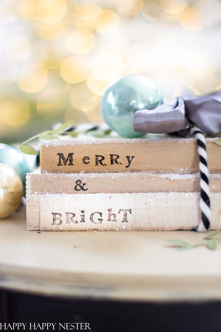 This easy Christmas Craft project is so fun to make. I love that you can recycle your old books and bring them back to life. This Christmas make sure to gather up your old books and create this cute holiday decor. #crafts #holidaycrafts #christmascraft #oldbooks