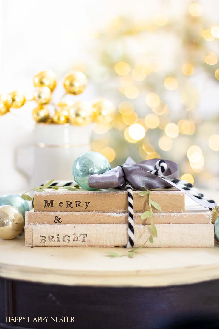 If you are looking for an easy Christmas Craft, then check out these cute stamped books. Gather some old books and alphabet stamps and make these easy project. #crafts #christmascrafts #stampproject