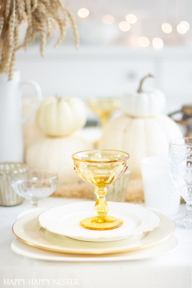 Here is a Thanksgiving Table Setting Made Easy. Find out how the 7 elements to set a Thanksgiving table step by step. This table has all-natural elements and wheat makes a beautiful fall centerpiece for a table. #thanksgiving #thanksgivingtable #tabledecor #createathanksgivingtable #tablesetting