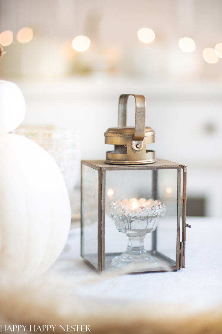 Here is a Thanksgiving Table Setting Made Easy. Find out how the 7 elements to set a Thanksgiving table step by step. Candles are a must when creating a table setting. This table has all-natural elements and wheat makes a beautiful fall centerpiece for a table. #thanksgiving #thanksgivingtable #tabledecor #createathanksgivingtable #tablesetting