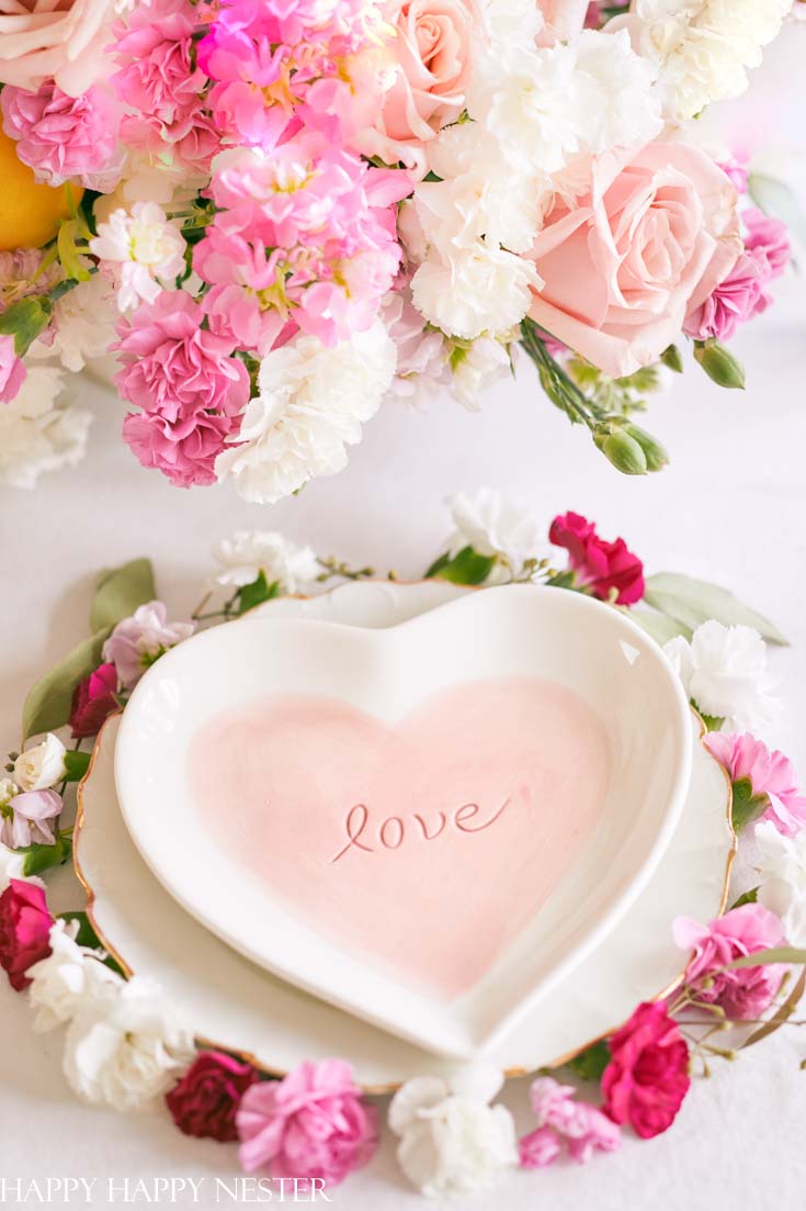 Create a pretty table setting and add some beautiful flowers. This post is full of Valentine's Day Table decor inspirations.