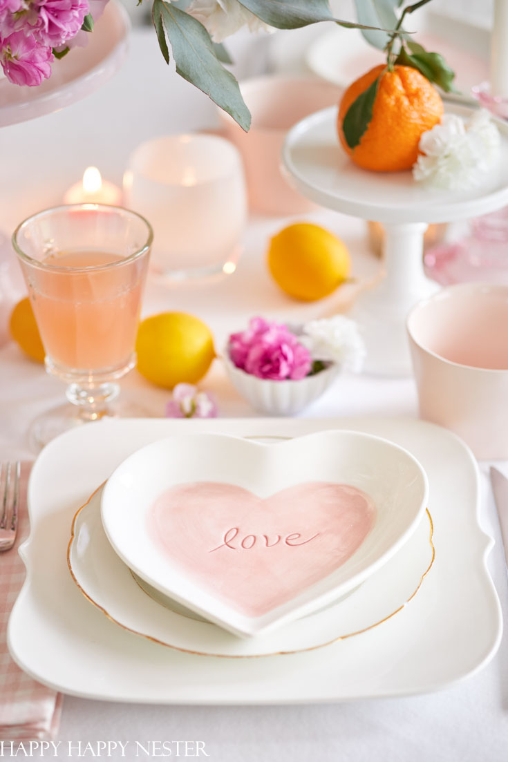 Choose some cute heart-shaped plates to create a pretty Valentine's Day Table. #valentines #tables