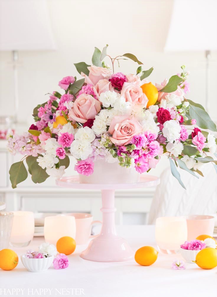 Flowers are always my main focal point to any table decor. This arrangement uses grocery store flowers. Find out which six things are needed to create a pretty table. #valentinesday