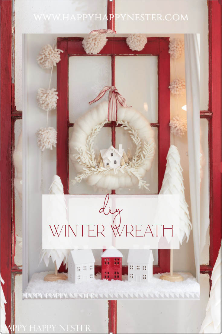 You're going to enjoy this DIY Winter Wreath Ideas Roundup. This post includes many styles and colors of wreaths, from pine to ornaments. Learn how to make this cute putz house holiday wreath.