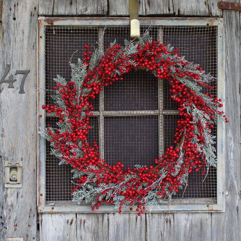 red berry with frosted pine wreath