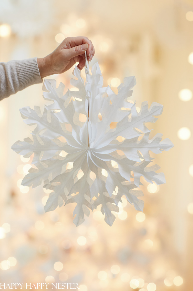 Decorating like the movie. Elf was my focus for our living room. Paper garlands, paper snowflakes and much more in creating this winter wonderland living room. 