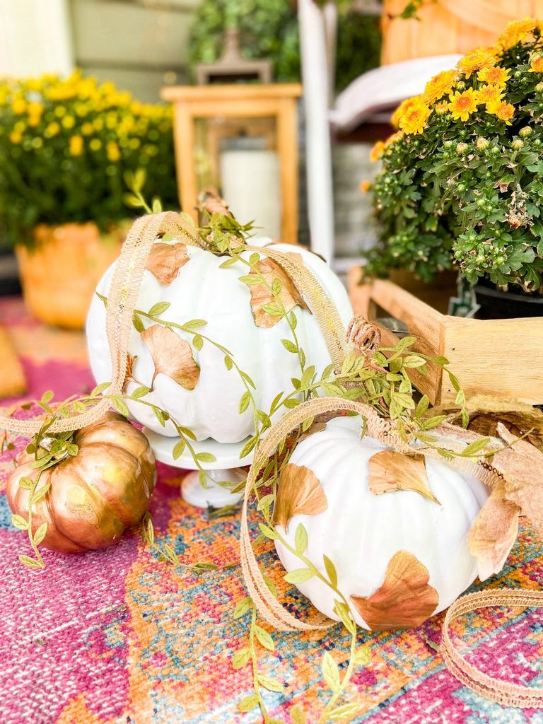 Decorative pumpkins with metallic gilded leaf accents