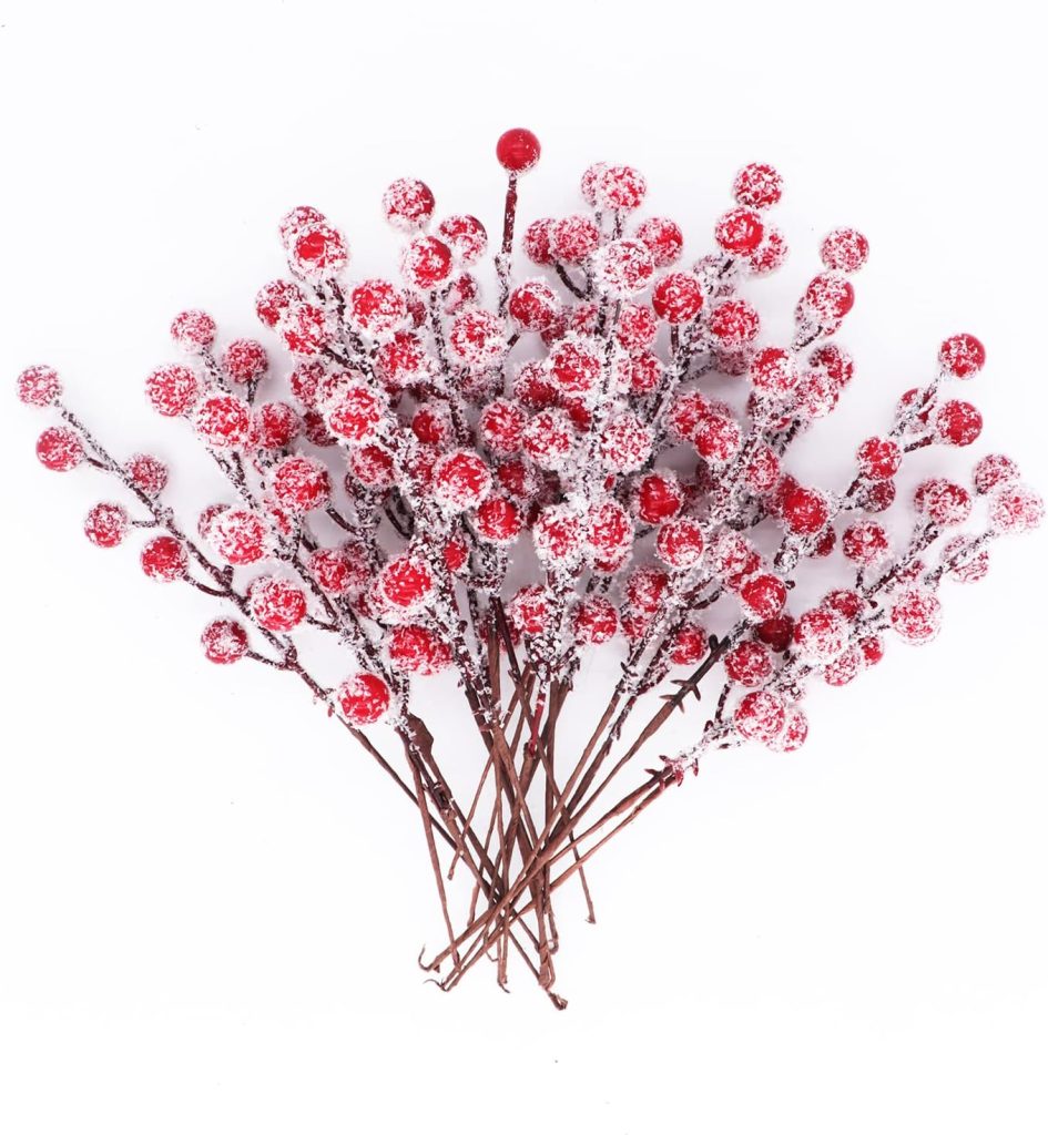 A bundle of artificial red berry stems covered in white artificial snow, arranged against a white background—perfect for adding festive charm to your red and white Christmas tree.