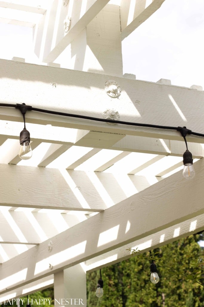 How to Hang Outdoor String Lights - Happy Happy Nester