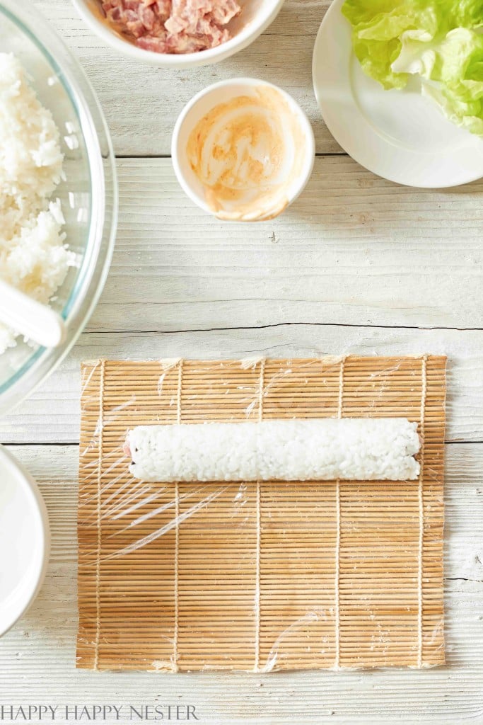 rolling sushi on a bamboo sushi mat