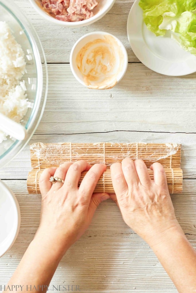 rolling sushi with a bamboo mat