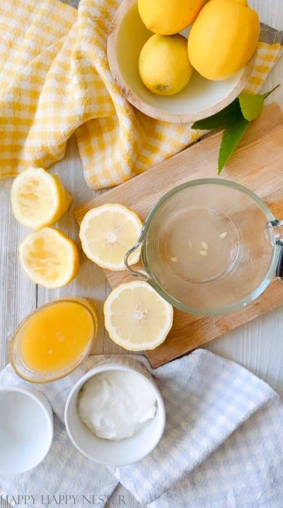 lemon juice in a glass measuring cup on a wood cutting board