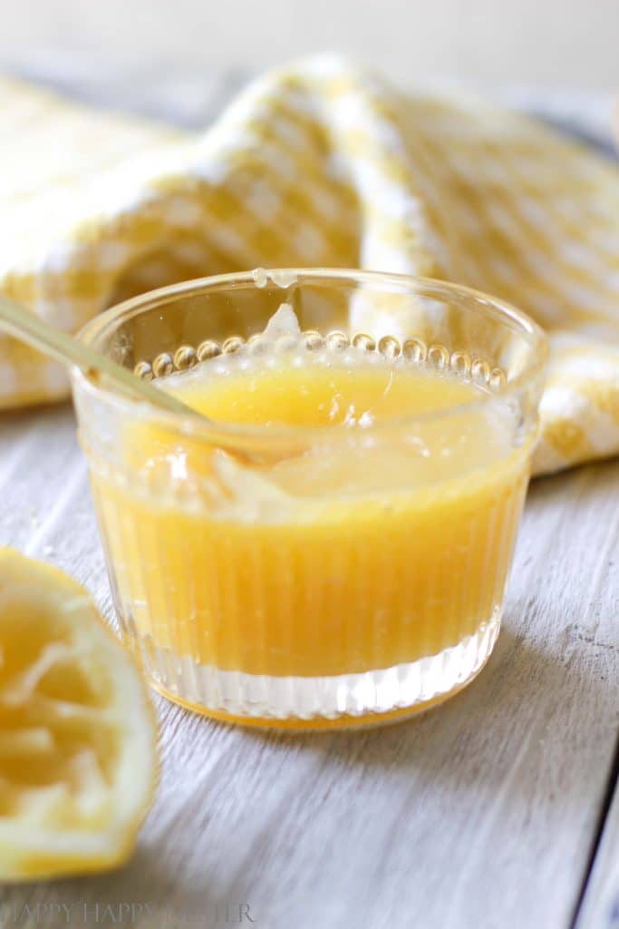 close up of lemon curd in a small glass bowl