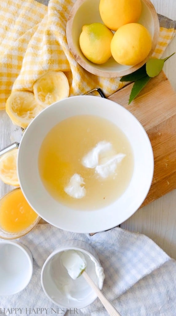 white bowl with lemon juice, sugar, and water. 
