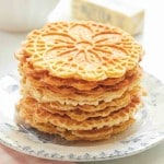 image of stacked gluten free pizzelles on a French blue plate