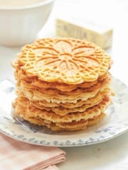 image of stacked gluten free pizzelles on a French blue plate