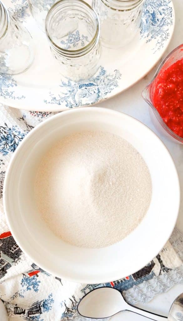 This post of my recipe for raspberry freezer jam shows a step by step tutorial. This step shows a bowl of sugar.