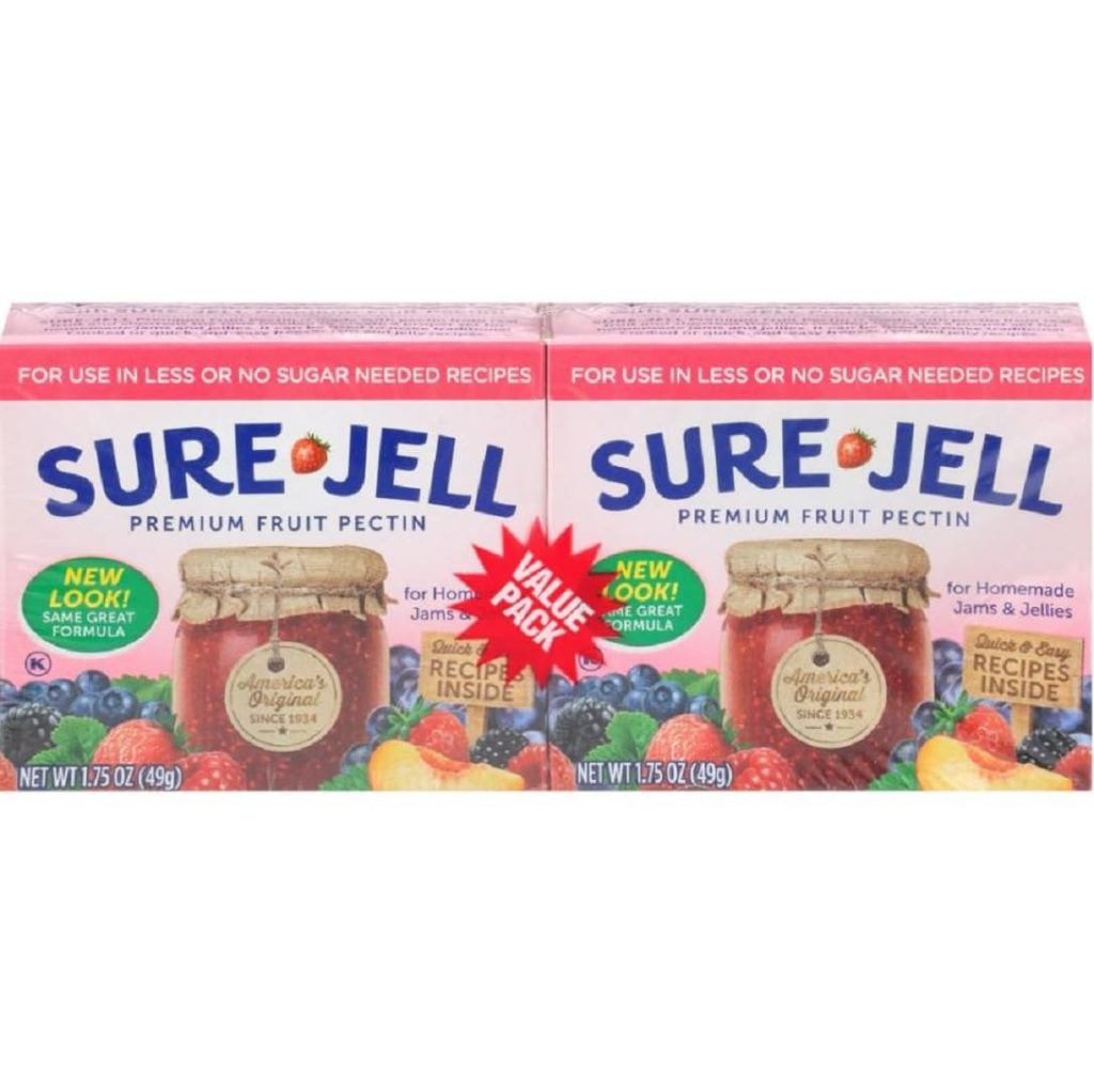 Two boxes of Sure-Jell premium fruit pectin for homemade jams and jellies, featuring assorted fruits and a jar of preserves on the front; includes a value pack with new formula and a recipe for raspberry freezer jam inside.