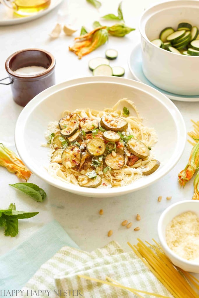 spaghetti alla nerano recipe shown on a table with all the ingredients