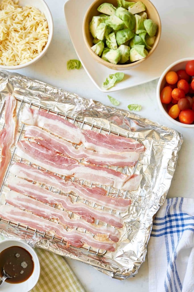 baking sheet with bacon on a rack on the sheet