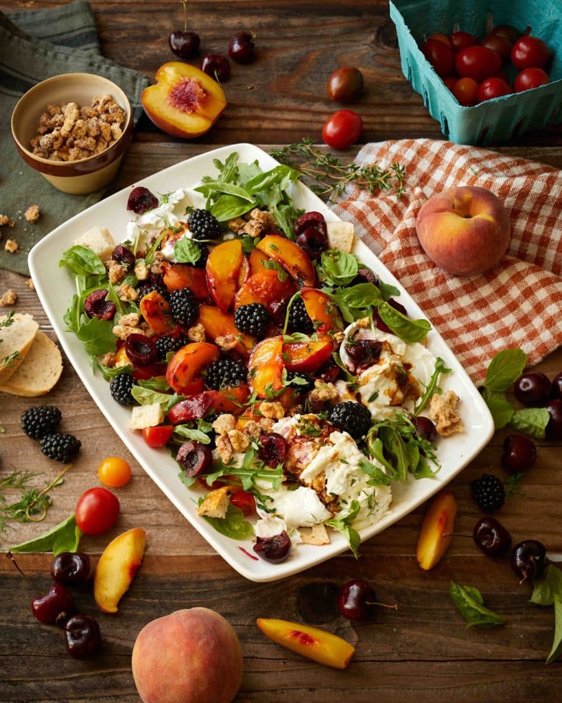 a plate of grilled peaches, black berries and goat cheese. This recipe is part of a salad bowl ideas collection