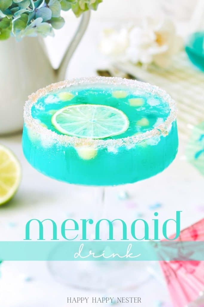 A blue mermaid water drink on a white table