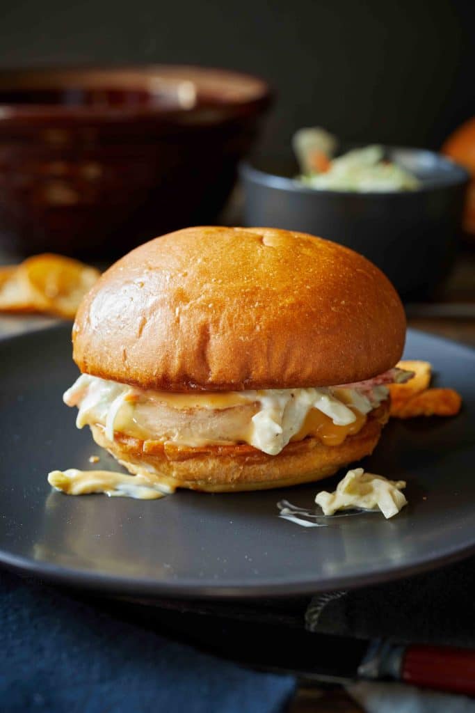 close-up of a trader joe's salmon burger on a black plate