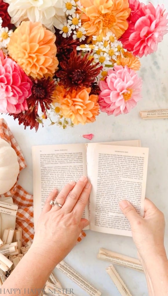 tearing out pages of a book to make this book wreath