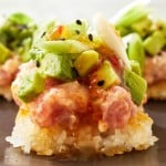 a close up of crispy rice sushi
