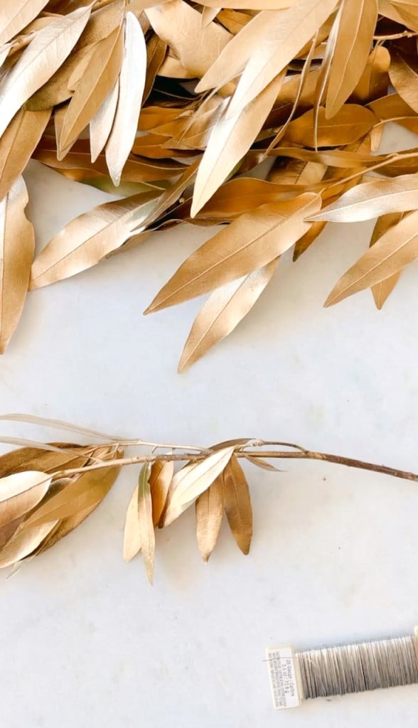 DIY fall garland tutorial showing the gold leaves and wire before making the garland