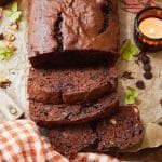 double chocolate banana bread sliced and on a piece of brown parchment paper