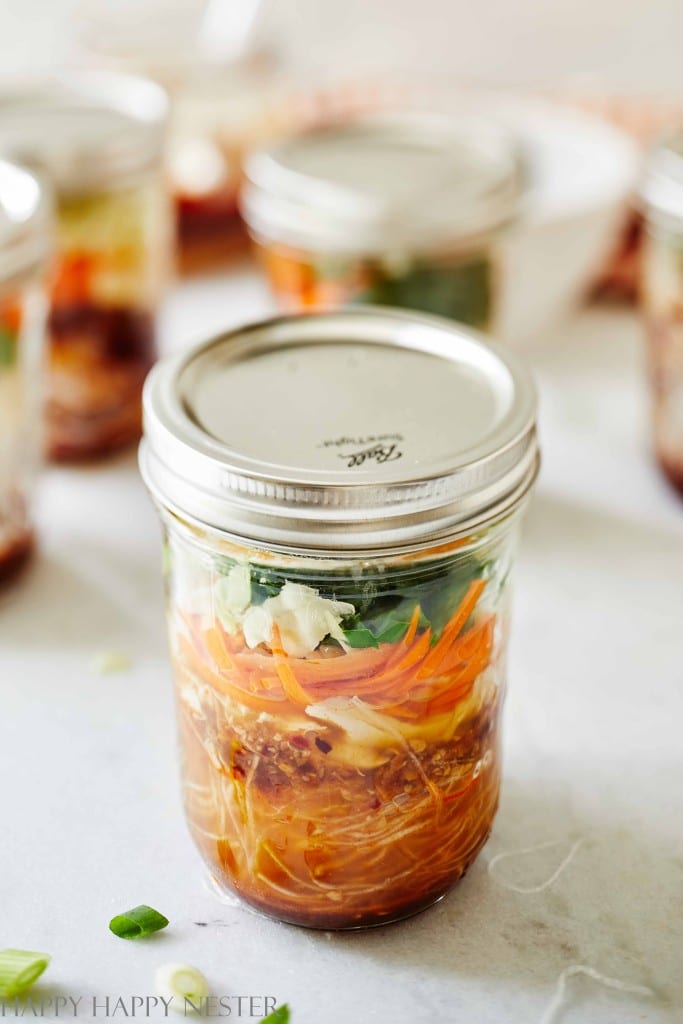 mason jar full of layers of food filled with boiling water