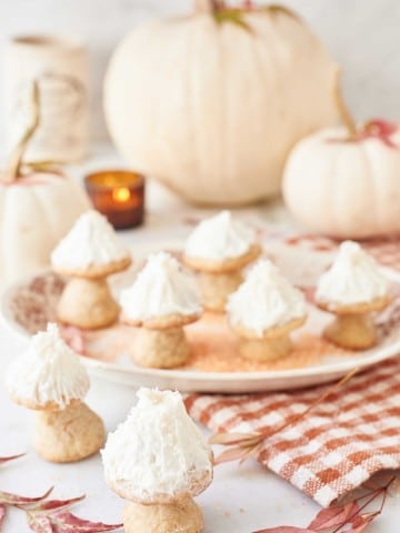 a table full of cookies shaped like mushrooms
