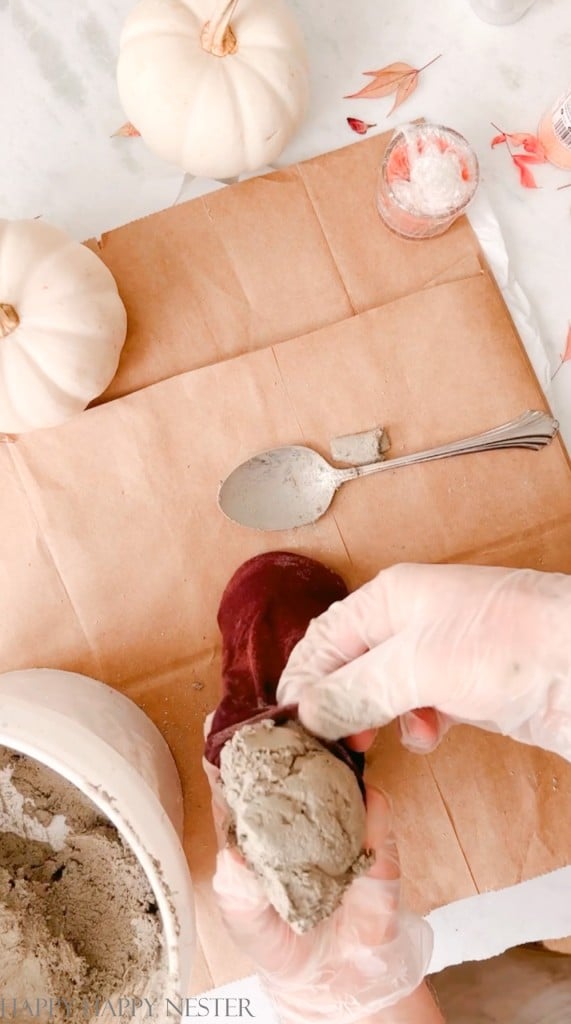 filling a panty hose with cement to make a pumpkin