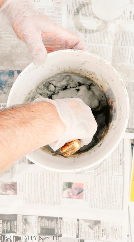 mixing cement for making fall pumpkins using panty hose