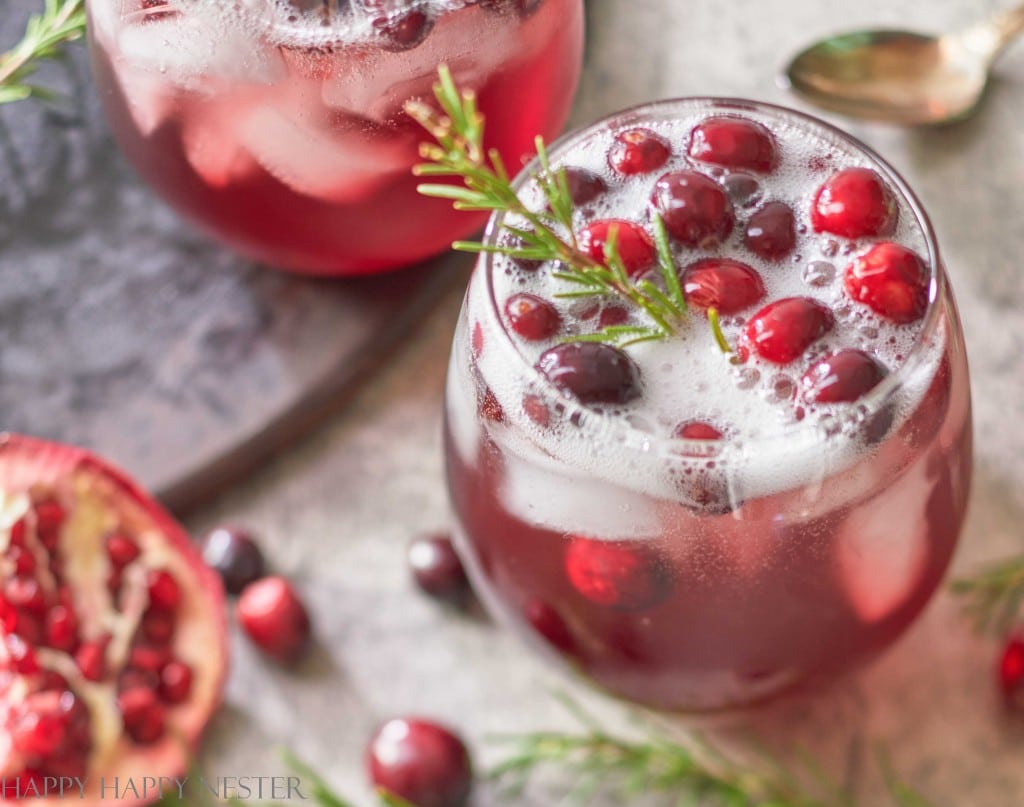 a close up of this cranberry holiday drink in a round glass