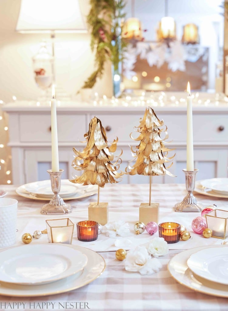 two diy tabletop christmas trees on a table decorated for the holidays