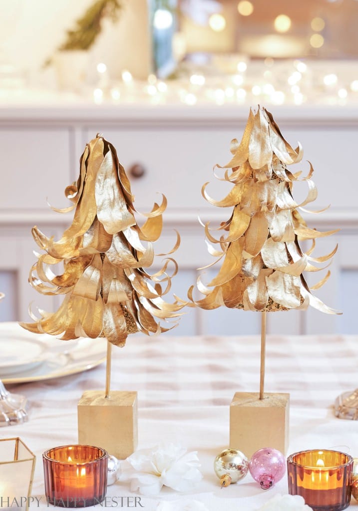 2 gold mini christmas trees