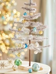 silver tinsel tree on a table top