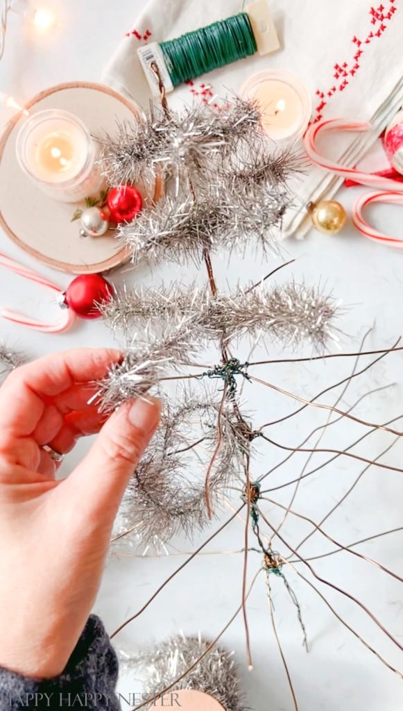 wrapping tinsel on a wire feather tree