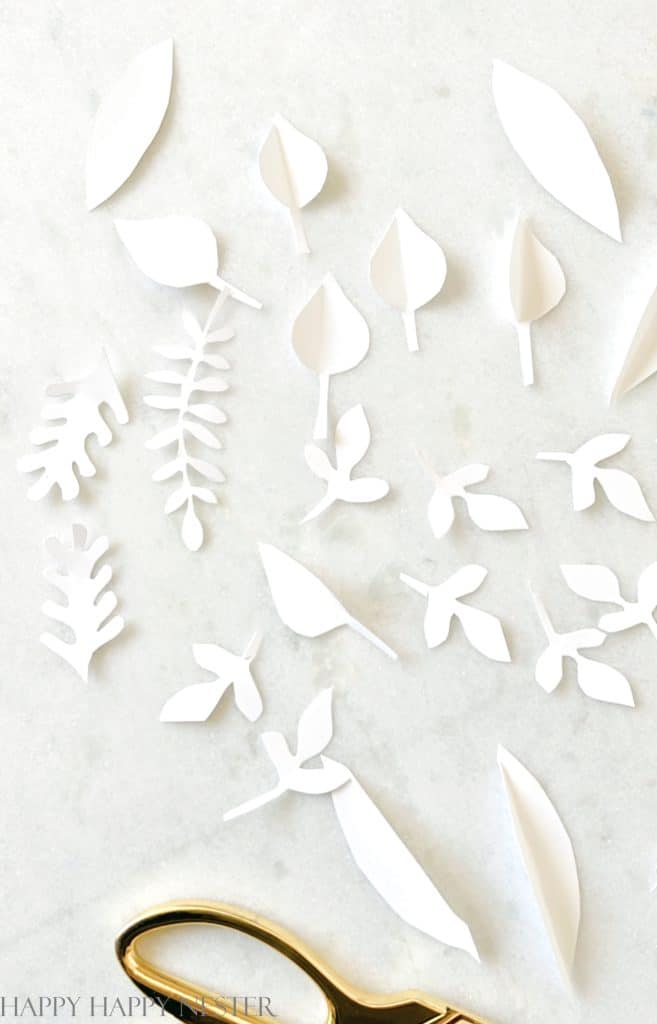showing the different paper leaves that will create a january winter wreath