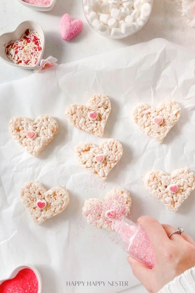 add pink sugar sprinkles to valentine's day rice krispie treats