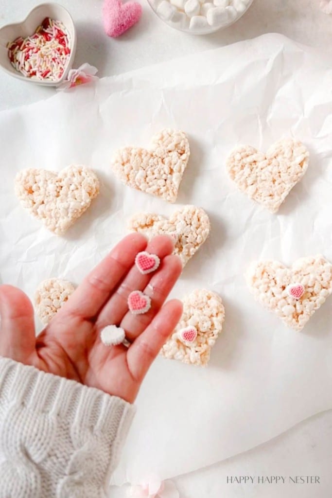 little heart shaped candies shown nestled in a hand